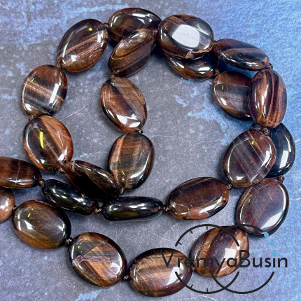Бычий глаз, плоские овальные бусины ок. 13х18 мм (1/2 нити, ок. 11 шт.)