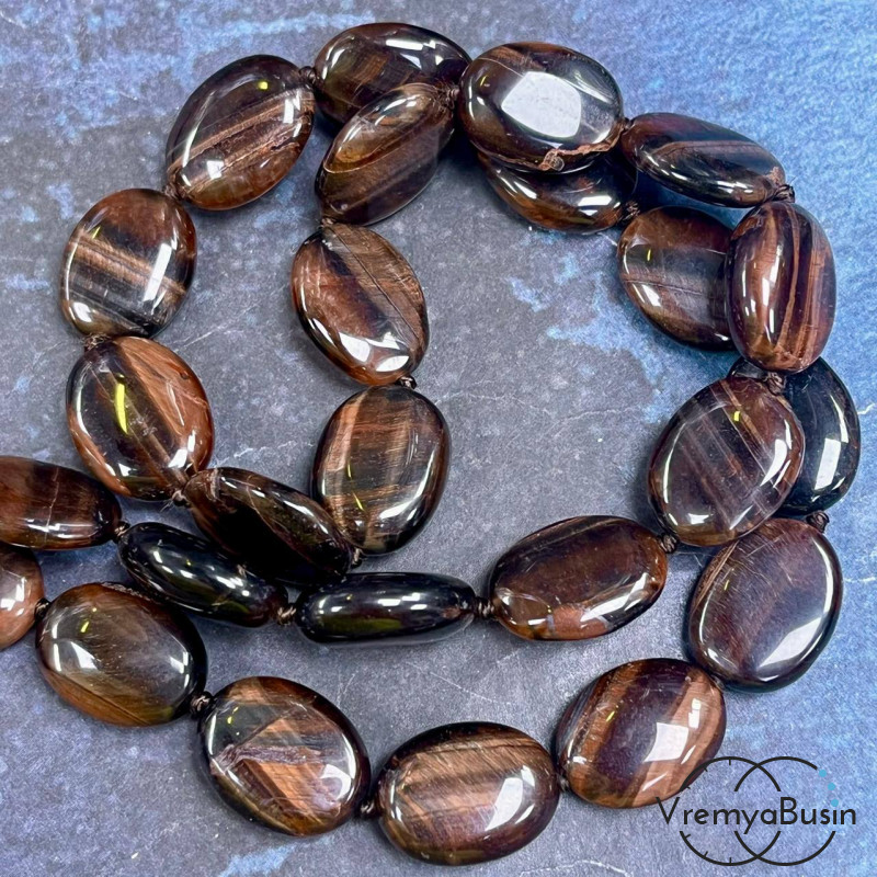Бычий глаз, плоские овальные бусины ок. 13х18 мм (1/2 нити, ок. 11 шт.)