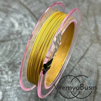 Японский стальной тросик Flexy49 в нейлоновой оплетке,   0.45 мм, цв. GOLD  (катушка 10 м.)