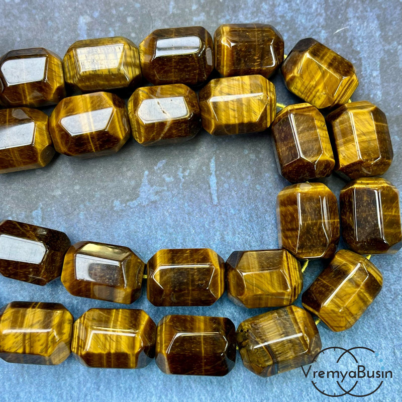 Тигровый глаз,    крупные овальные граненые бусины, ок. 20х15 мм  (1/2 нити, ок. 8 шт.)