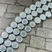 Гематит, плоская бусина с орнаментом "Штурвал", 10х3 мм, цв. серебро (1 шт.)