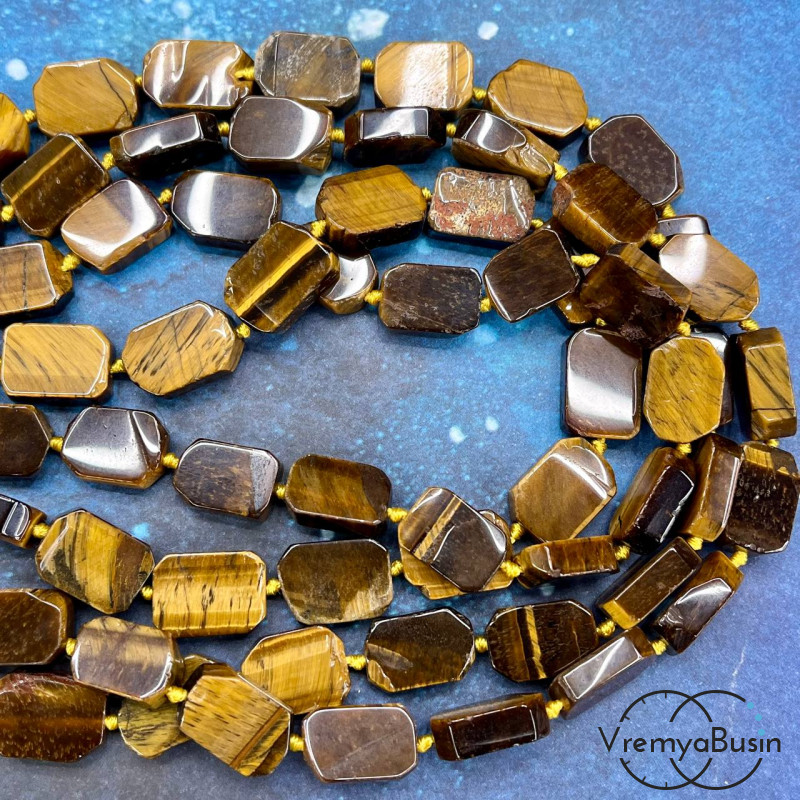 Тигровый глаз.   Овальные плоские бусины, ок. 12х16 мм (нить, ок. 22  шт.)