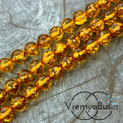 Янтарь, имит. из смолы,  бусины   шарики 12 мм       (нить, ок.  45   шт.)