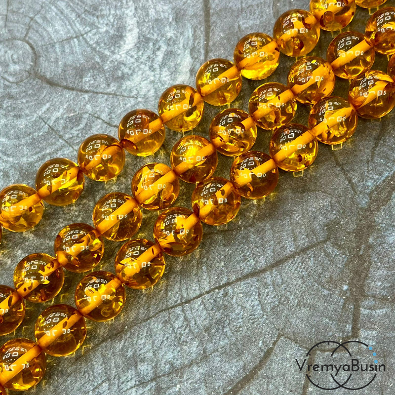 Янтарь, имит. из смолы,  бусины   шарики 12 мм       (нить, ок.  45   шт.)