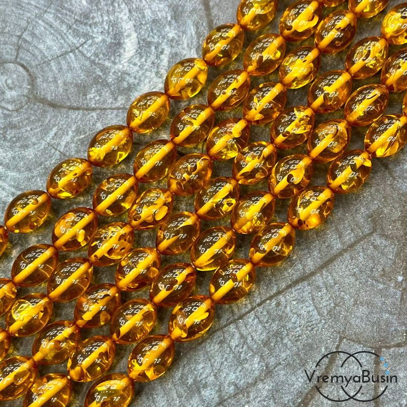 Янтарь, имит. из смолы,  бусины     бочонки 9х13 мм     (нить, ок.   44  шт.)
