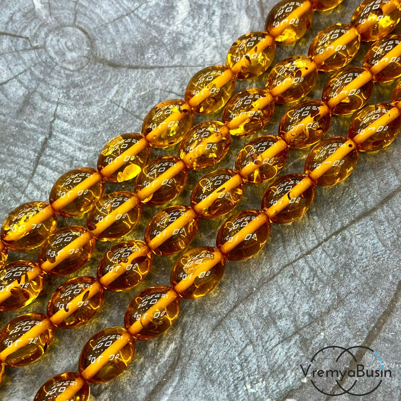 Янтарь, имит. из смолы,  бусины      бочонки 11х15 мм    (нить, ок.  38   шт.)