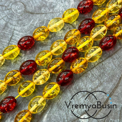 Янтарь, имит. из смолы,  бусины      бочонки 11х15 мм    (нить, ок.  38   шт.)