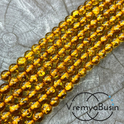 Янтарь, имит. из смолы,  бусины       шарики 8 мм   (нить, ок.   70  шт.)