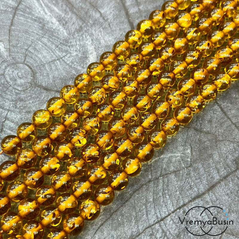 Янтарь, имит. из смолы,  бусины       шарики 8 мм   (нить, ок.   70  шт.)