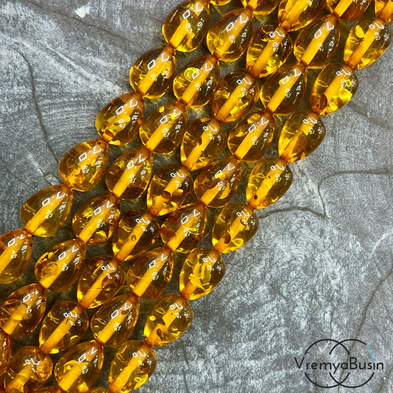 Янтарь, имит. из смолы,  бусины   капли 10х14 мм       (нить, ок.    40 шт.)