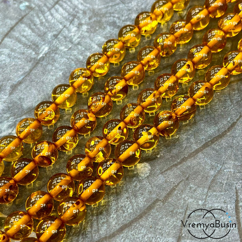 Янтарь, имит. из смолы,  бусины    шарики 10 мм      (нить, ок.   55  шт.)