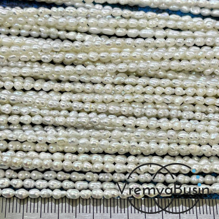 Жемчуг натуральный речной, овальный ок. 2,5х3 мм, цв. белый (нить, ок.  35 см.)