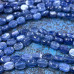 Кианит натур., бусины плоские овалы ок. 6х8х4 мм (1/2 нити, ок. 24 шт.)