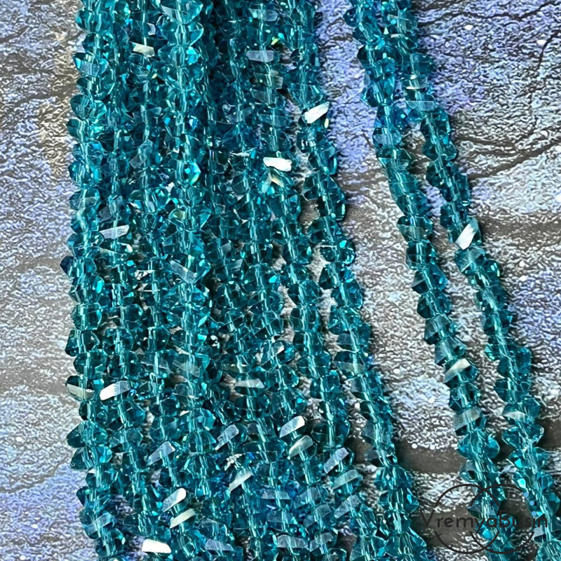 Бусины-треугольники из граненого стекла 4х6 мм, цв. темно-бирюзовый  (нить ок. 35 см., ок. 85 шт.)