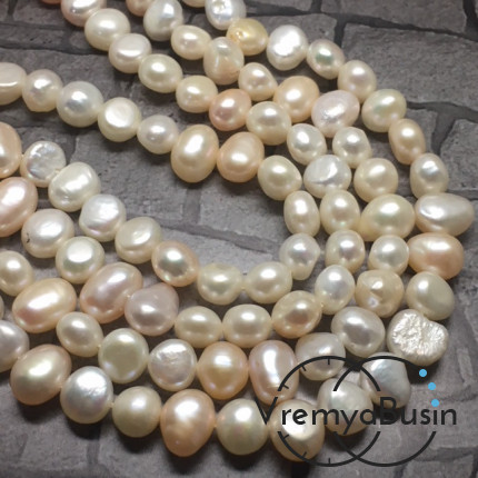 Жемчуг натуральный речной, бело-кремовый овальный ок.7х9 мм (нить 40 см.)