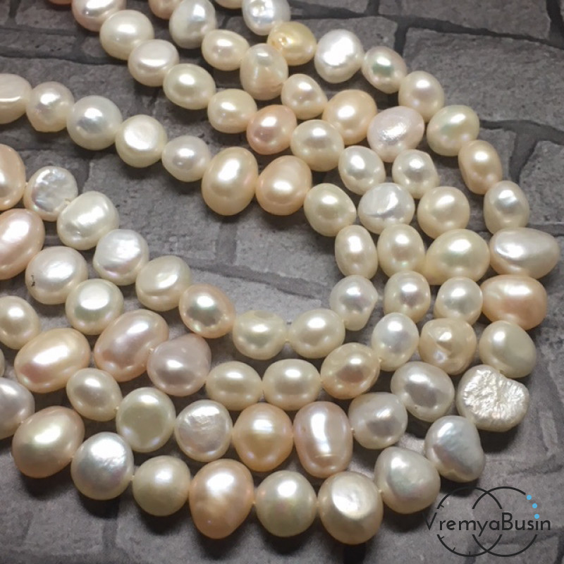 Жемчуг натуральный речной, бело-кремовый овальный ок.7х9 мм (нить 40 см.)