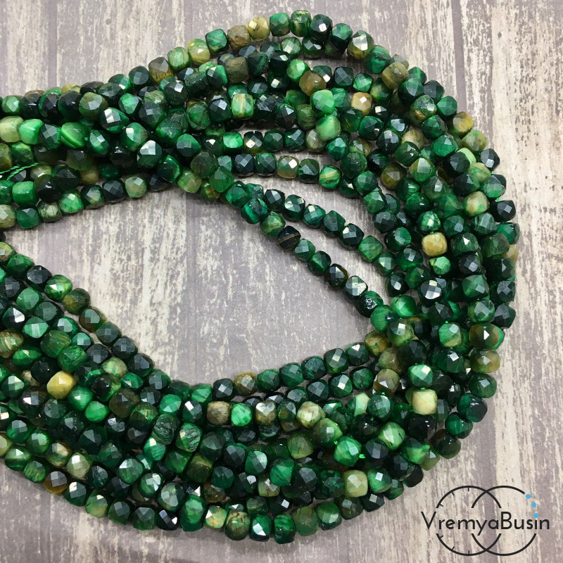Тигровый глаз натур., тонир. цв. зеленый, кубик с ювелирной огранкой,     5х5  мм (1/2 нити, ок.   37    шт.)